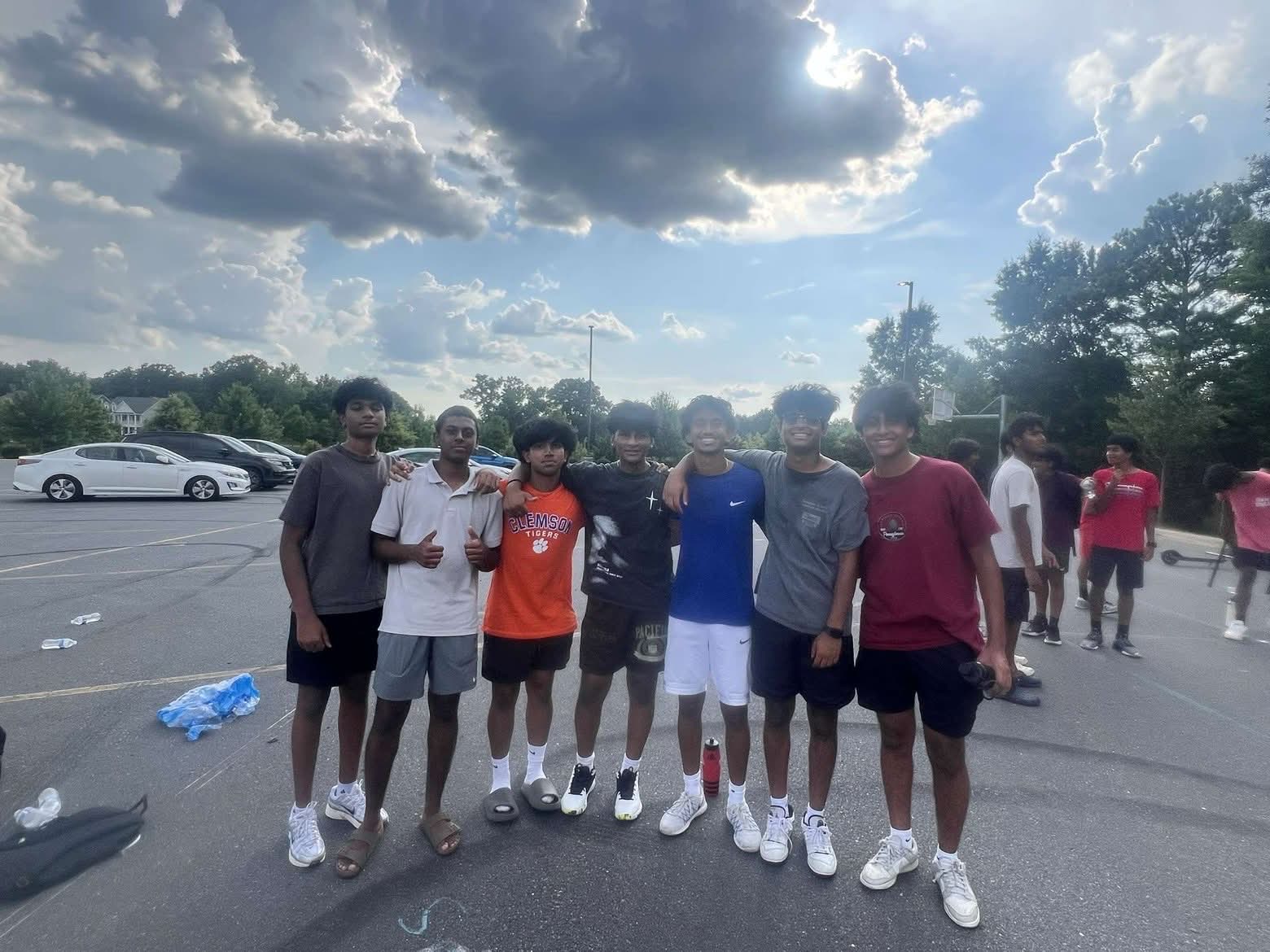 HFF basketball tournament group photo with bracket board